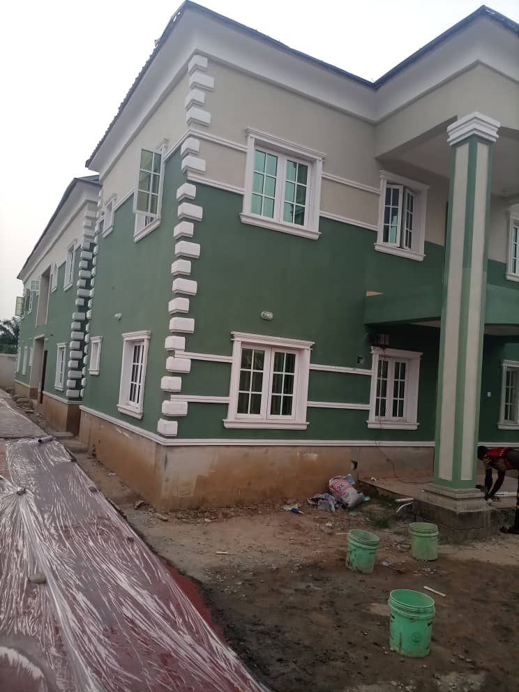 The Building Was Painted with A Dark Green Emulsion